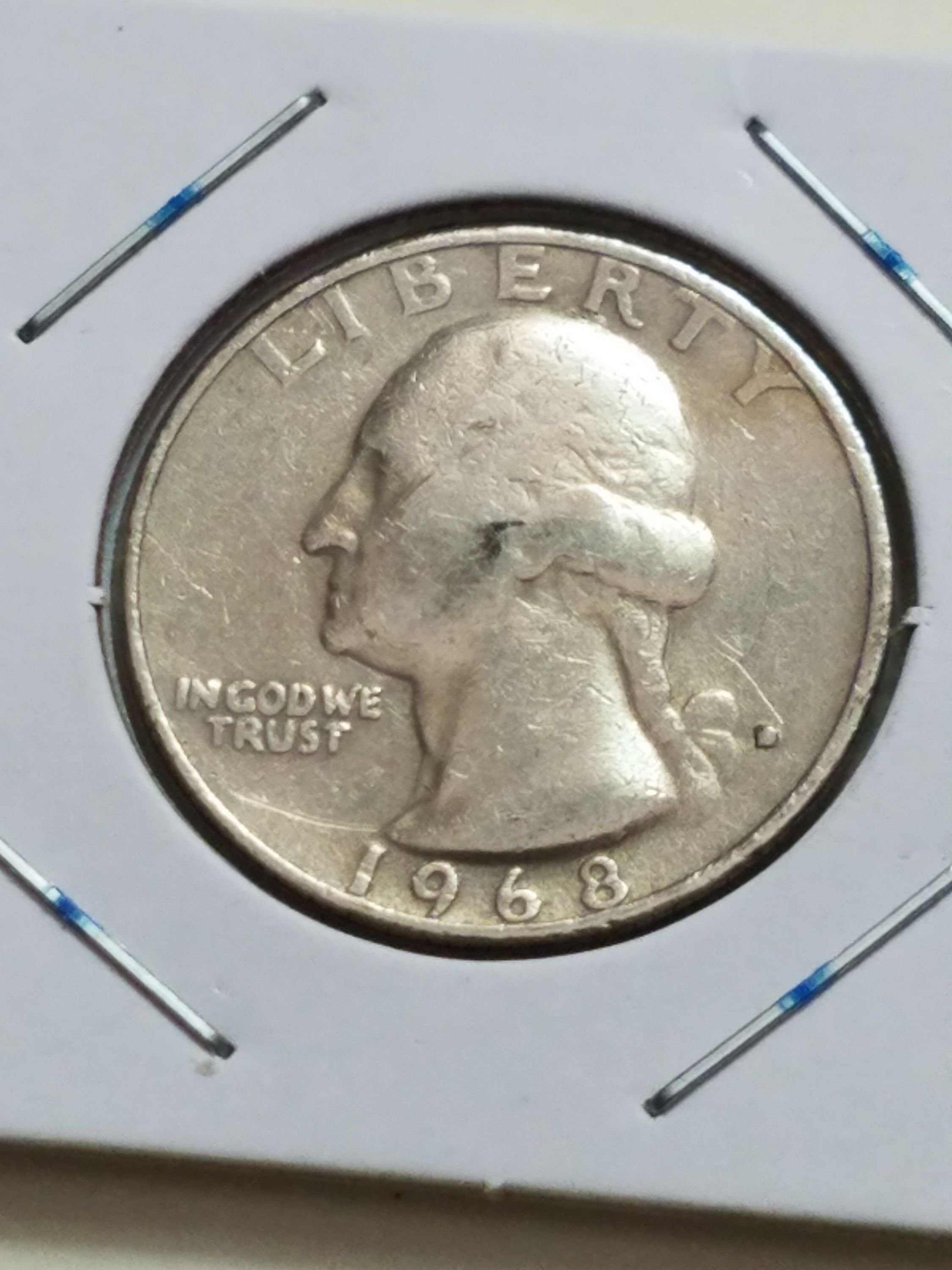 1968 quarter off-center strike error with design shifted and blank crescent of planchet visible