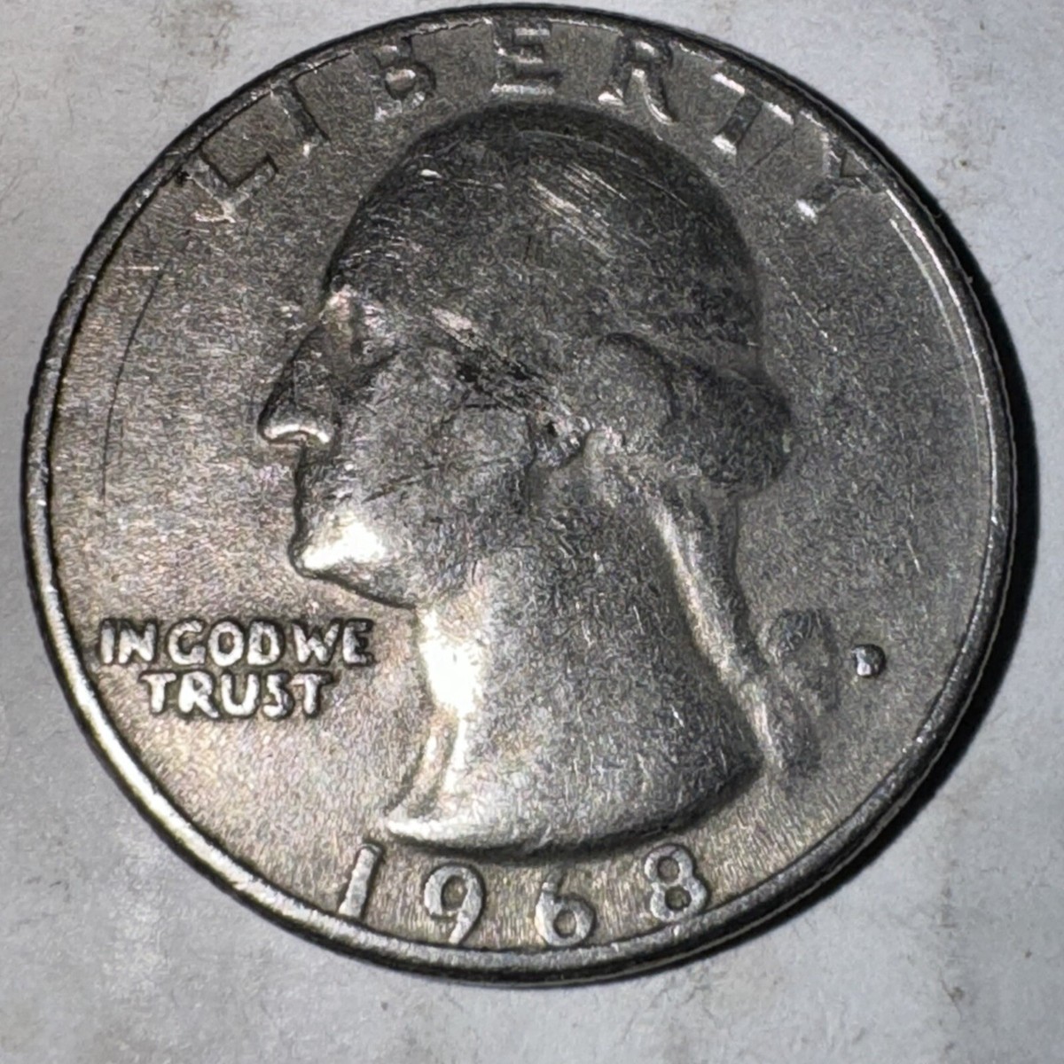 1968-D quarter repunched mint mark close-up showing secondary D impression overlapping primary D